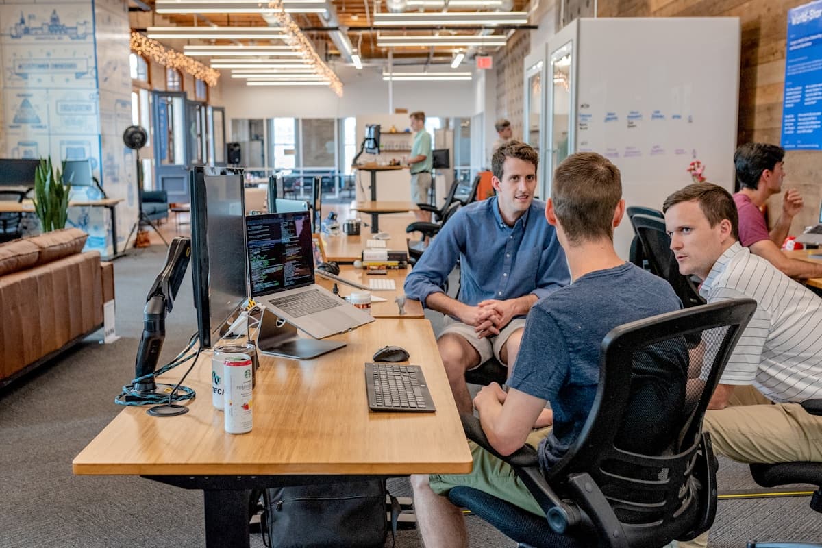 Business owner shaking hands with a web development agency partner during a meeting