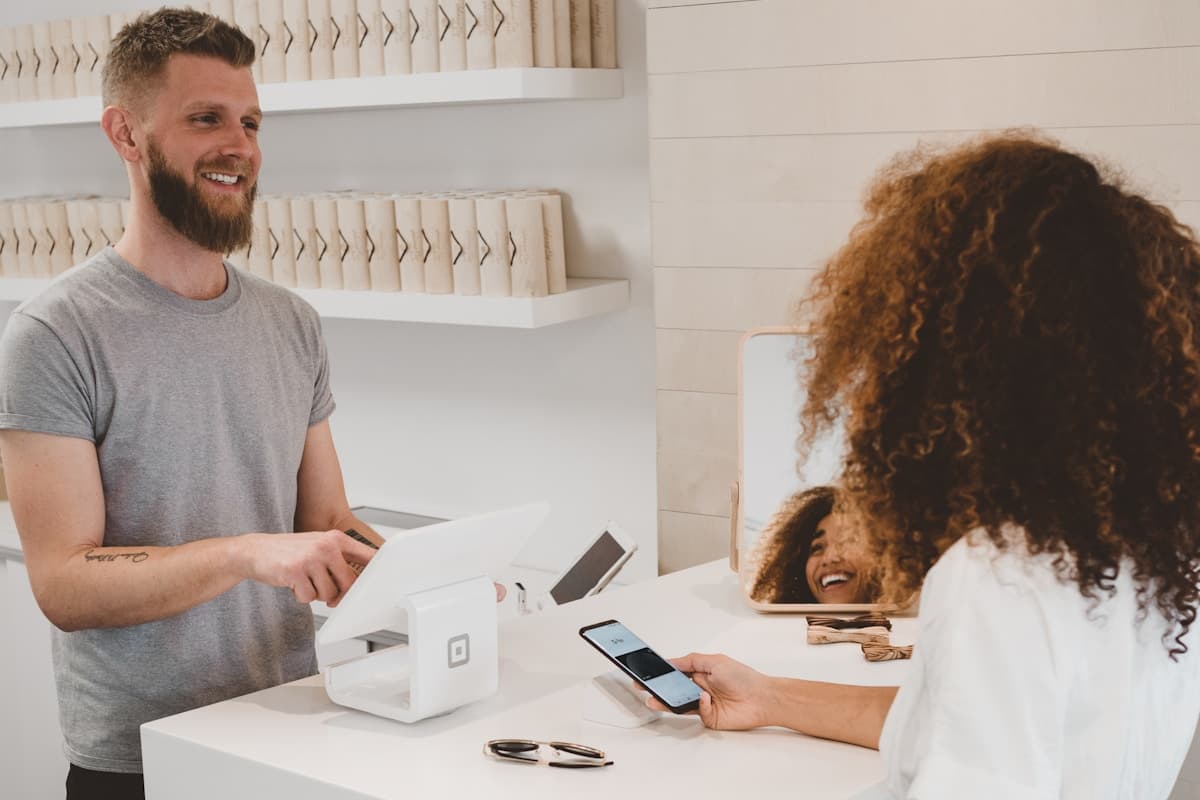 Small business owner using a mobile app to manage orders and communicate with customers